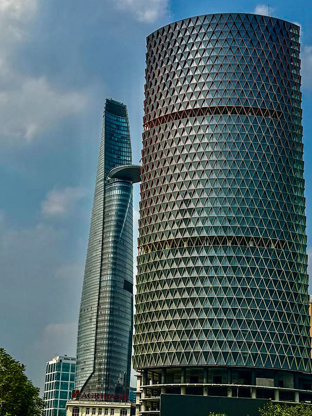 Bitexco Financial Tower seen from Saigon open‑top bus upper deck