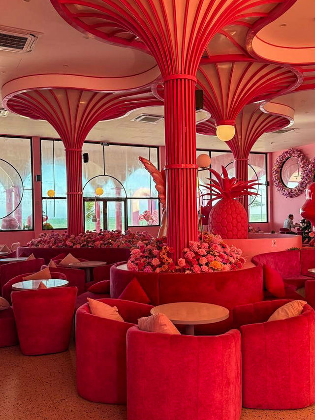 Pink staircase and flamingos inside pink fairytale cafe