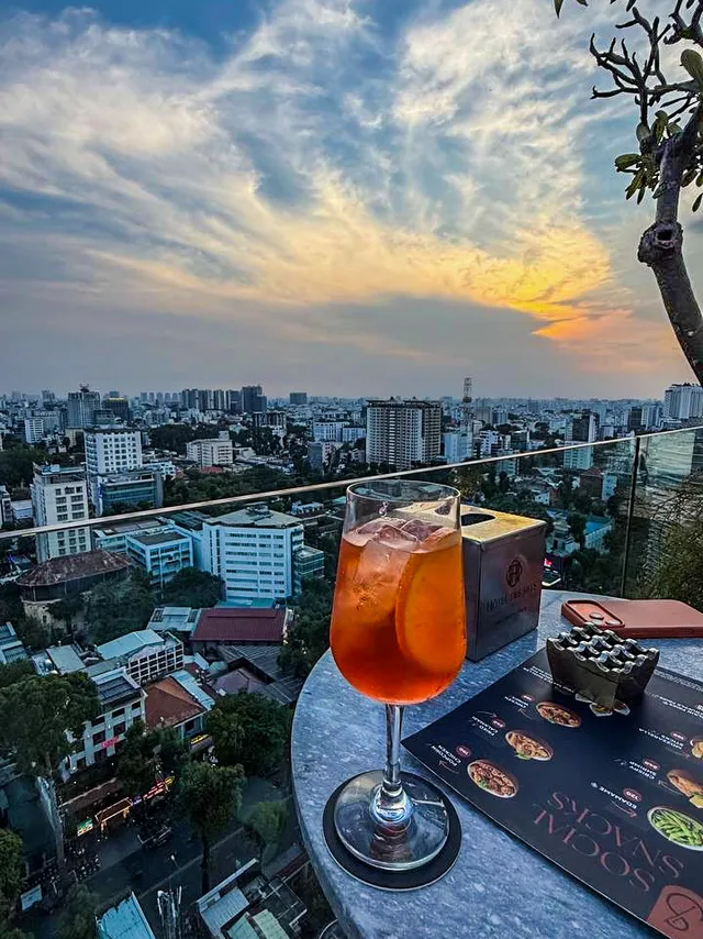 Signature cocktail being prepared by a bartender at Social Club Rooftop Saigon
