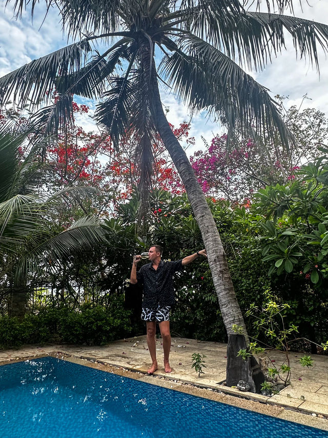 Tropical garden with tall palm trees at private pool villa nha trang