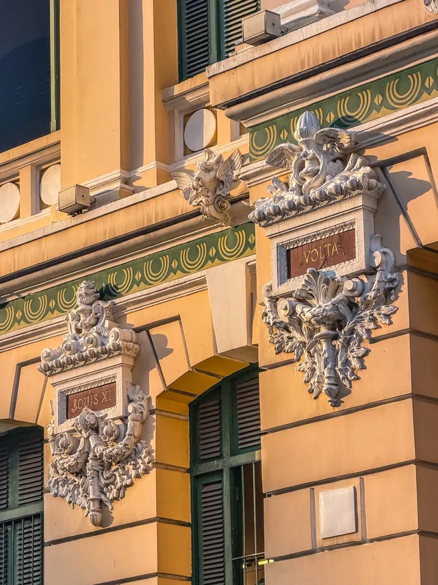 Bright yellow facade of Saigon Central Post Office with arched windows