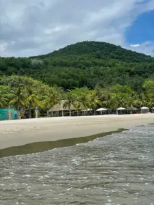 Couple floating in calm emerald water at Nhũ Tiên Beach Nha Trang Little Bali