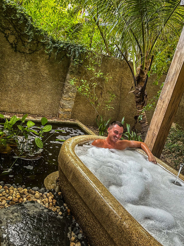 Relaxing in jacuzzi surrounded by flowers at private pool villa nha trang