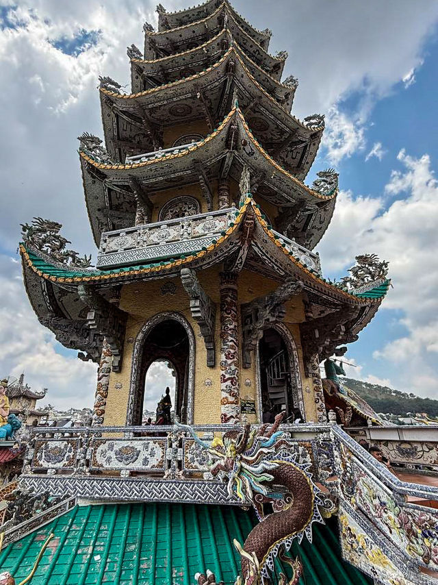 Main tower glittering with shattered glass and ceramic mosaics at beer bottle dragon pagoda