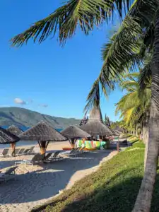 Private beach with empty loungers at Hon Tam mud baths overnight hack