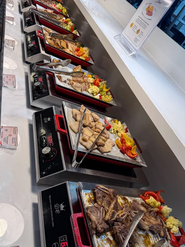 Grilled meats and hot dishes station at QooQoo Buffet Nha Trang