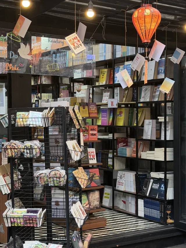 Evening lights illuminating the bookstores on Nguyen Van Binh Book Street
