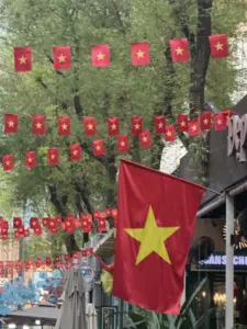 Wooden book stalls with Vietnamese and English titles on Nguyen Van Binh Book Street