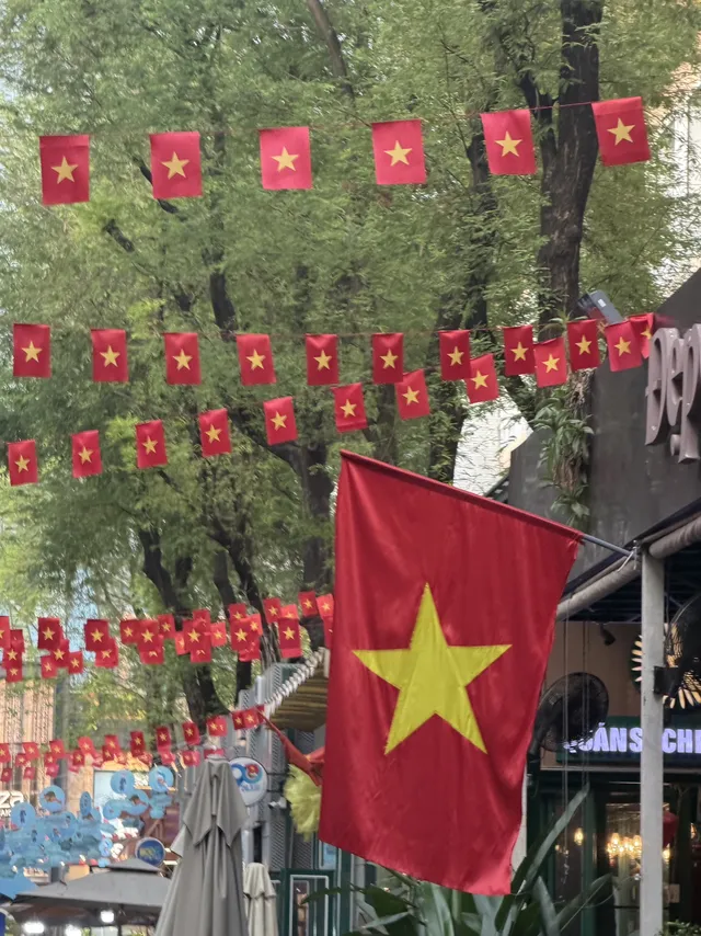 Wooden book stalls with Vietnamese and English titles on Nguyen Van Binh Book Street