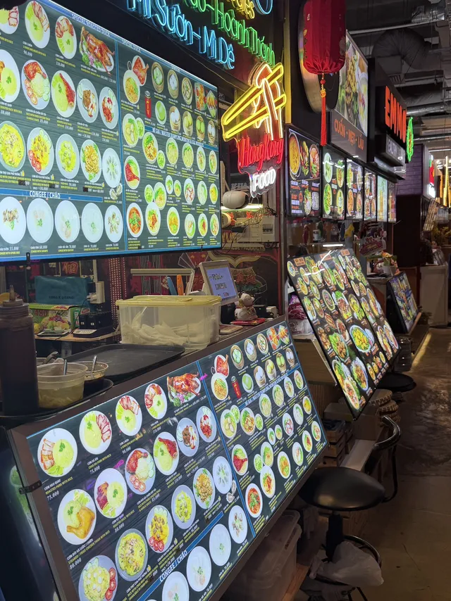 Vietnamese bun bo Hue and banh mi served at a stall in Central Market Saigon