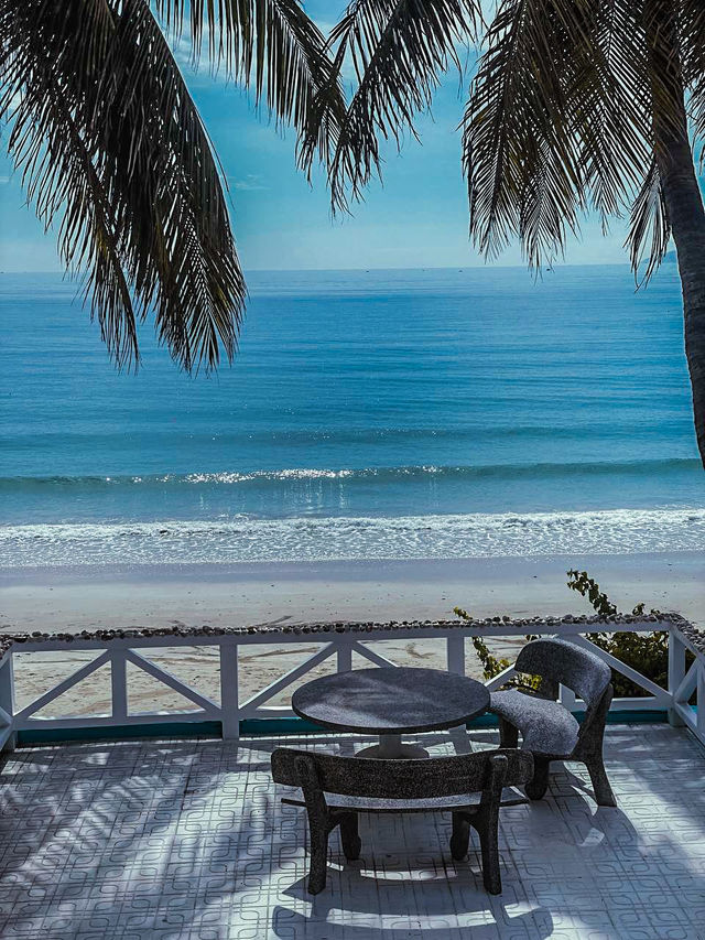Wooden loungers facing the sea at lost track of time beach Nha Trang