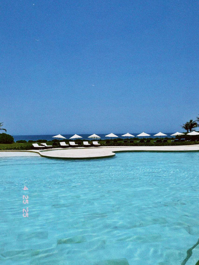Infinity saltwater pool overlooking pristine beach at vietnam greenest resort private pools
