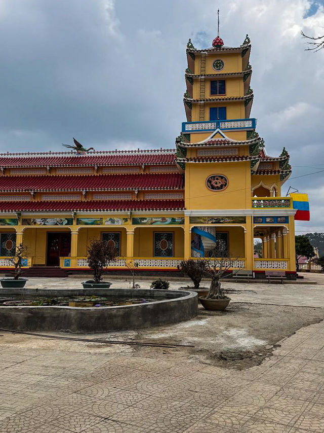 Colorful mosaic tile details on the walls of Cao Dai Temple Da Lat