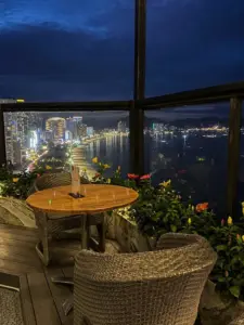 Cocktail with city lights background at Sky Lounge Nha Trang