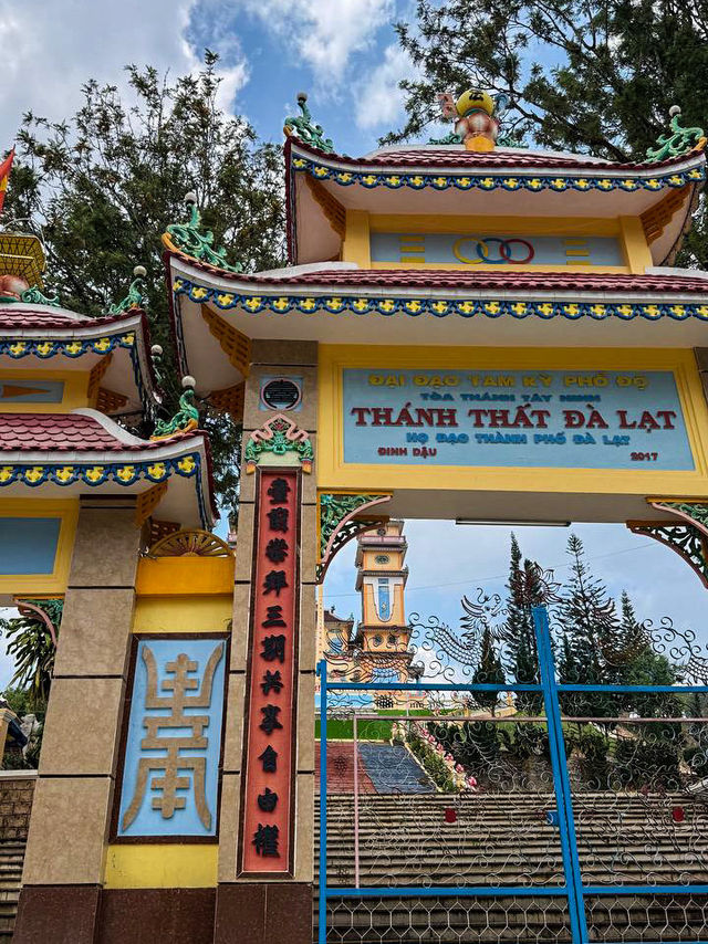 Panoramic hilltop view of green valleys from Cao Dai Temple Da Lat