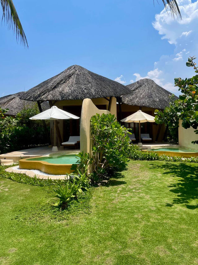 Open‑air spa treatment room surrounded by greenery at vietnam greenest resort private pools