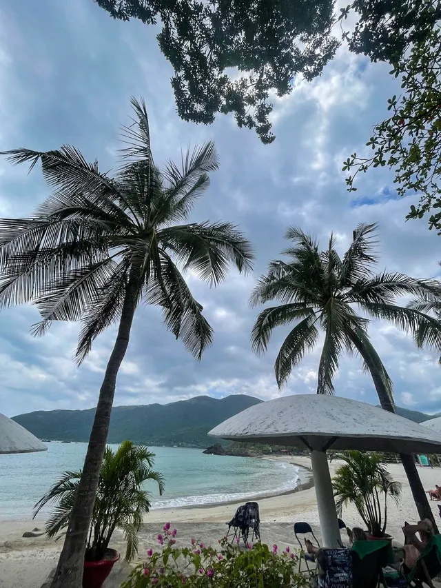 Local seafood café and coconut stand at Nhũ Tiên Beach Nha Trang