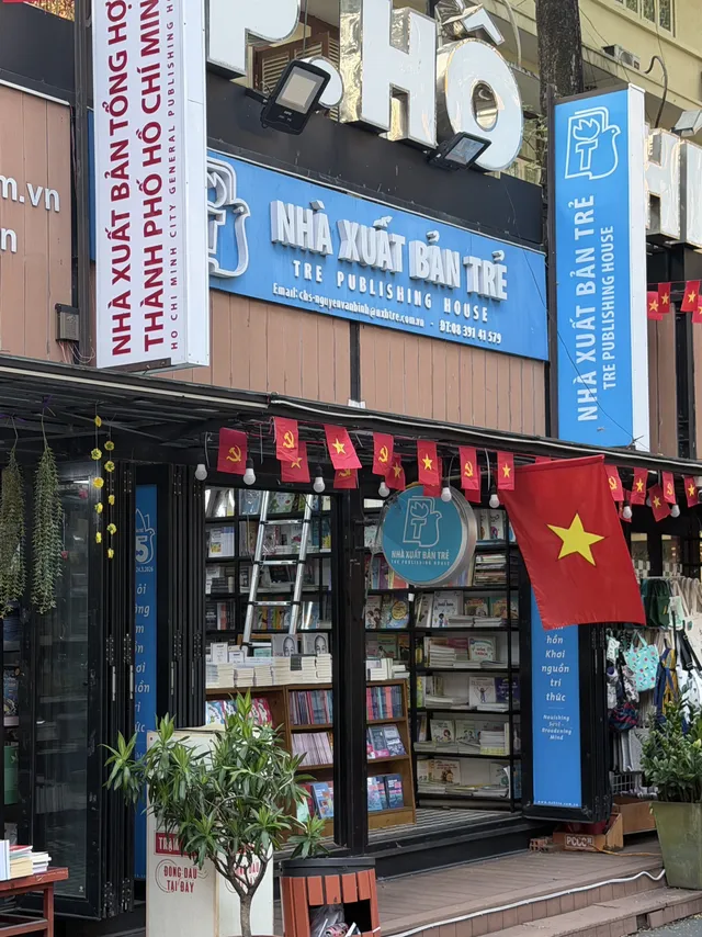 Entrance sign of Nguyen Van Binh Book Street with Cathedral spire in the background