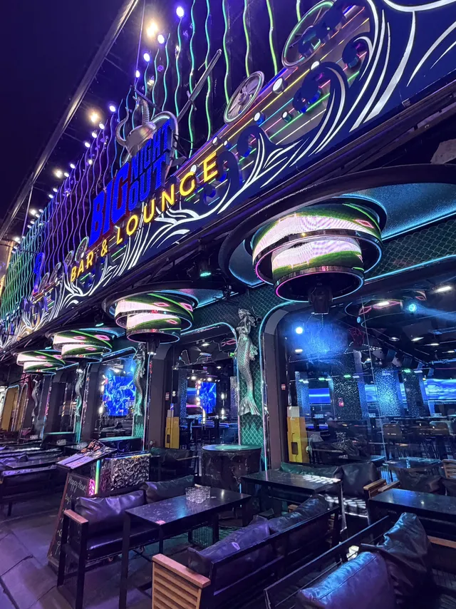 Neon lights and street performers on Bui Vien Walking Street