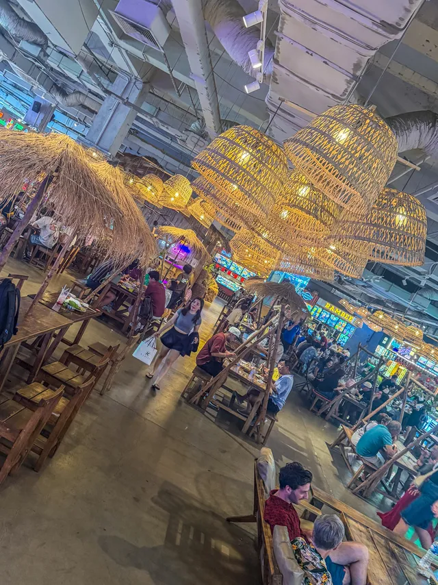 Clothing and souvenir stalls with clearly marked prices in Central Market Saigon