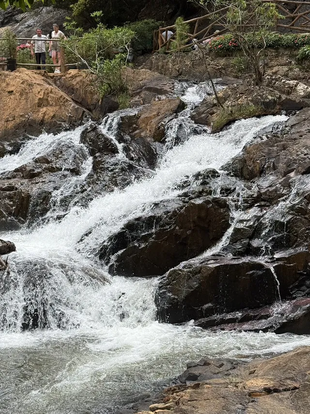 Small pool and white foam at the base of Datanla Waterfall Da Lat