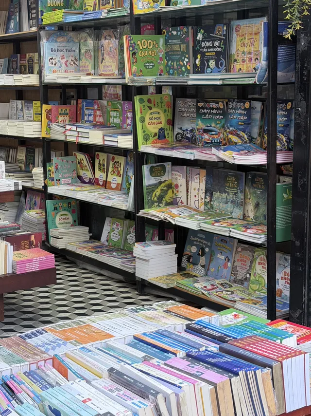 Hand‑painted postcards and crocheted bookmarks sold on Nguyen Van Binh Book Street