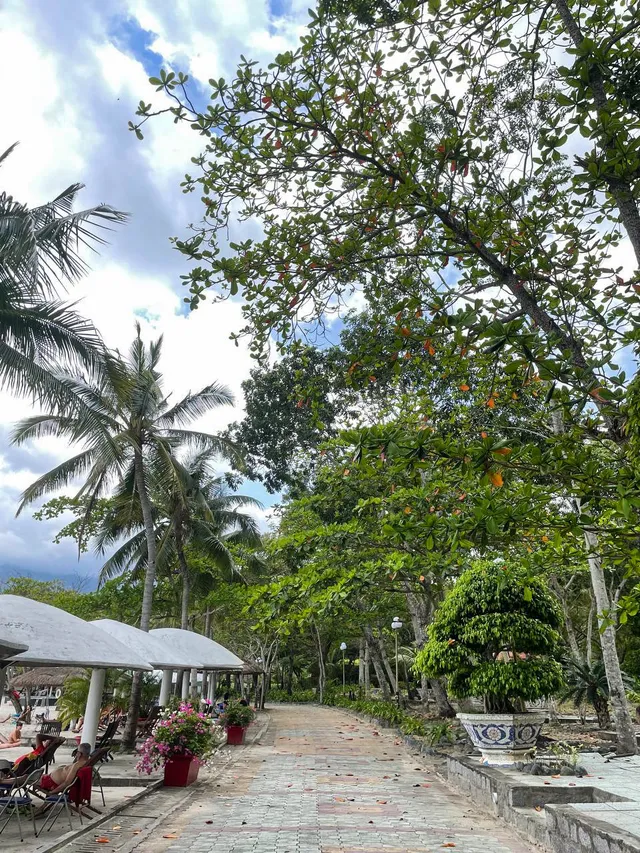 Mountain backdrop and calm bay at Nhũ Tiên Beach Nha Trang
