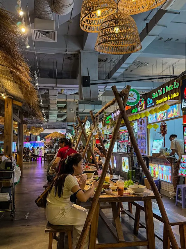 Co.op Food outlet and currency exchange counter inside Central Market Saigon