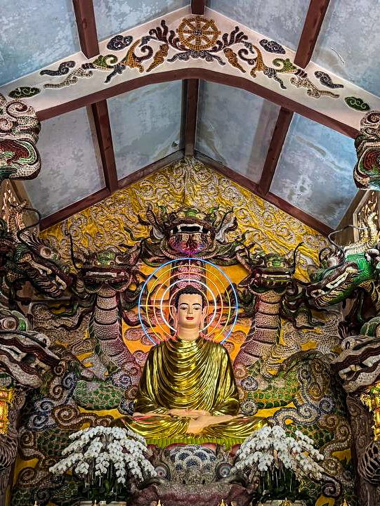 Meditation cave with Buddha statue beneath golden buddha dalat