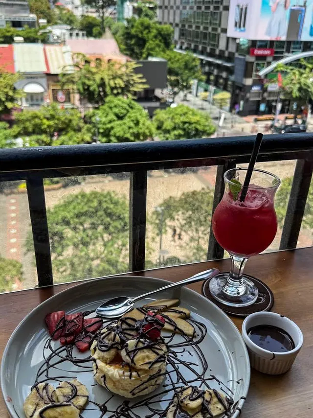 Barista preparing Vietnamese coffee in a cozy corner of Cafe Apartments Saigon
