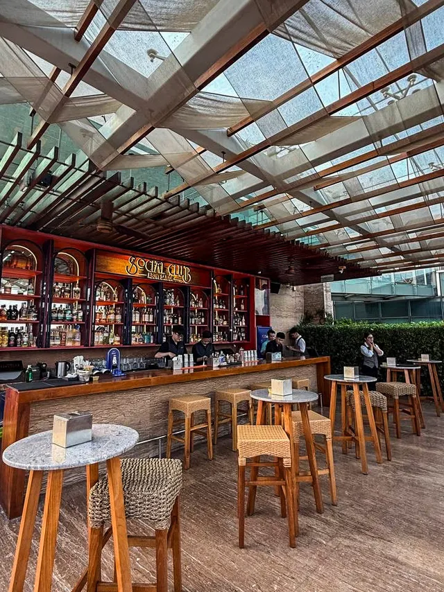 Plush sofas and chill electronic music vibe at Social Club Rooftop Saigon