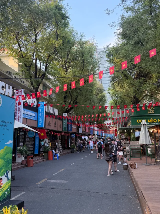Entrance sign of Nguyen Van Binh Book Street with Cathedral spire in the background