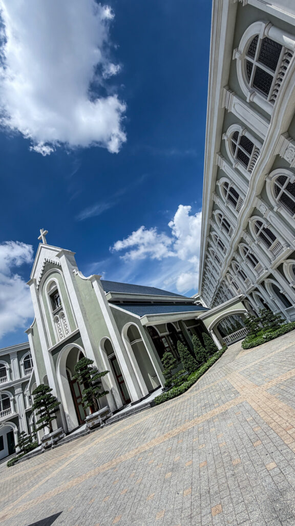 Chi Hoa Church Gothic rose window and stone tower Saigon