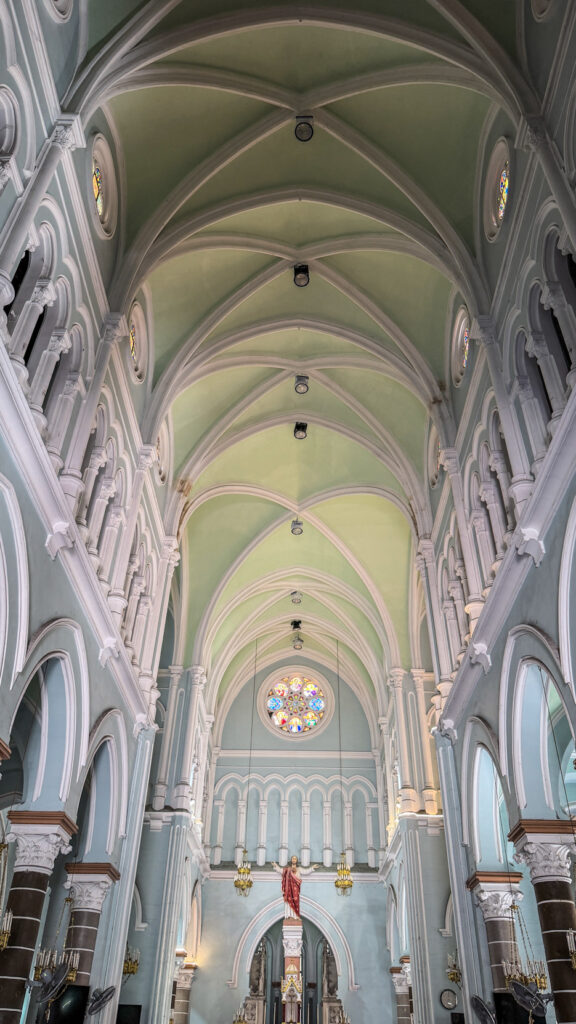 Huyện Sỹ Church yellow French-colonial façade District 1 Saigon