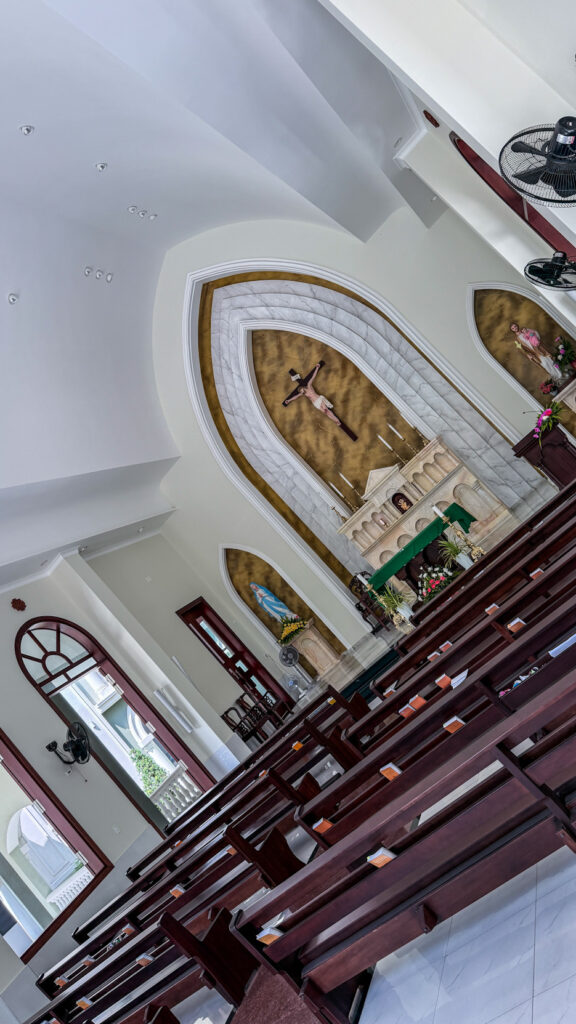 Chi Hoa Church Gothic rose window and stone tower Saigon