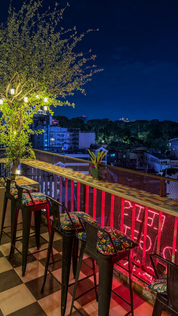 Le'Fê Rooftop poolside terrace and Bitexco Tower view Saigon