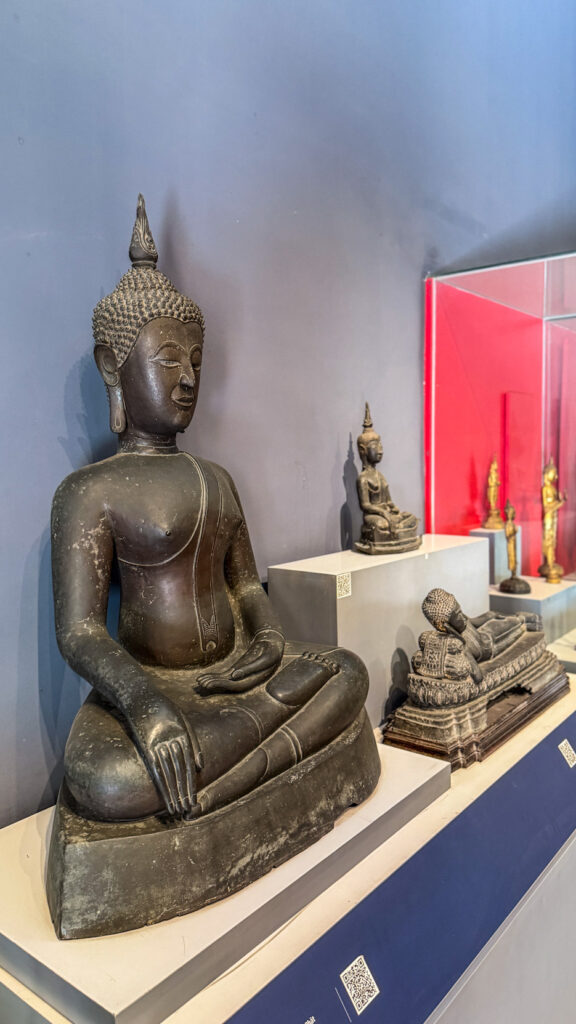 Vietnam History Museum Saigon pagoda-style building with bronze drums and Cham sculptures