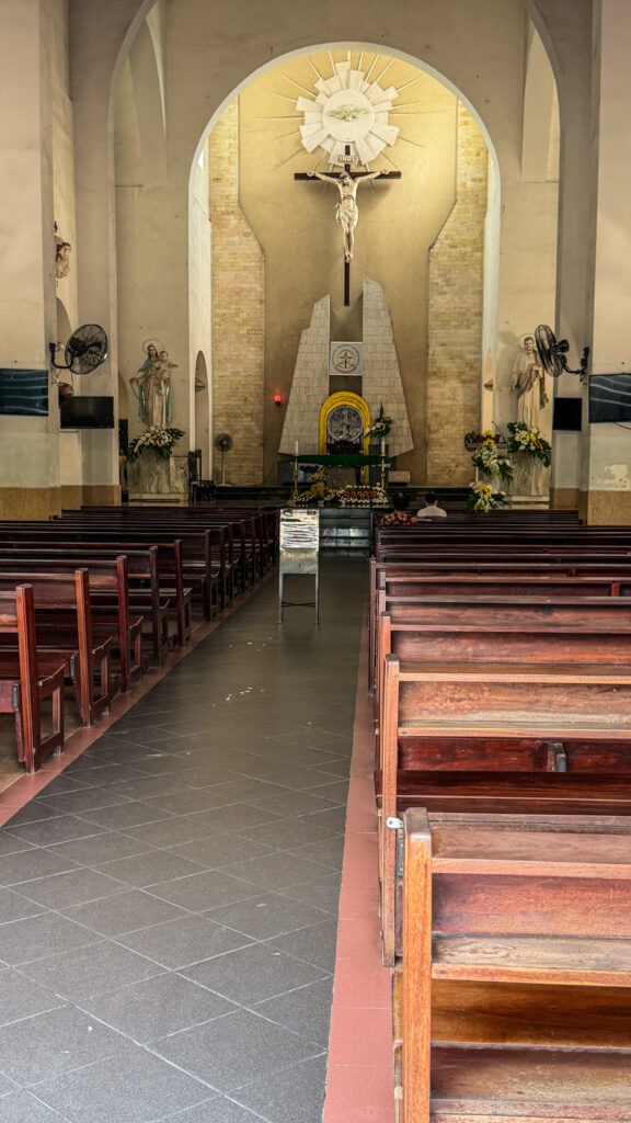 Chi Hoa Church Gothic rose window and stone tower Saigon