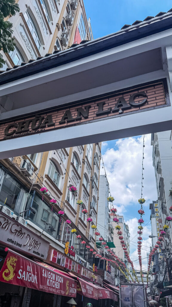 Chứa An Lạc quiet temple street with Buddhist pagoda and incense Saigon