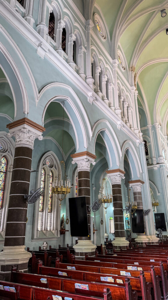Huyện Sỹ Church yellow French-colonial façade District 1 Saigon
