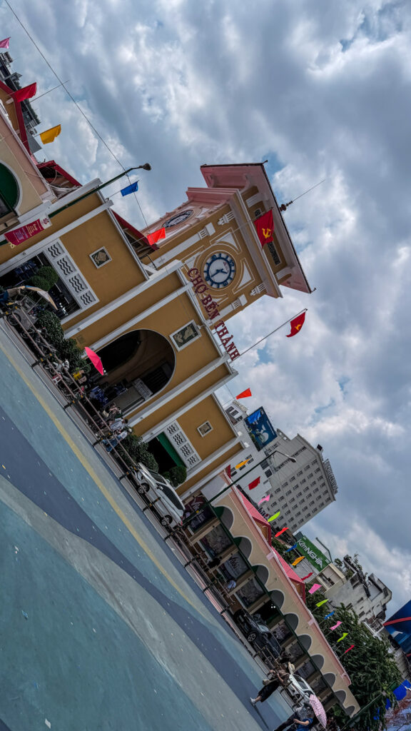 Ben Thanh Market interior with dried fruit stalls and clock tower Saigon