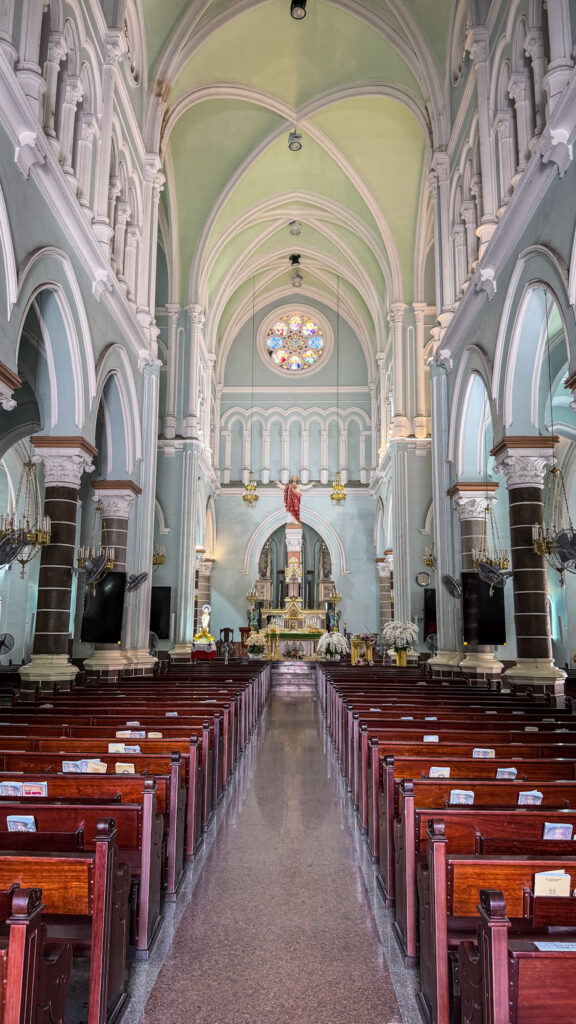 Huyện Sỹ Church yellow French-colonial façade District 1 Saigon
