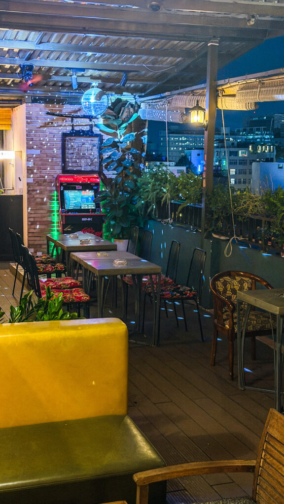 Le'Fê Rooftop poolside terrace and Bitexco Tower view Saigon