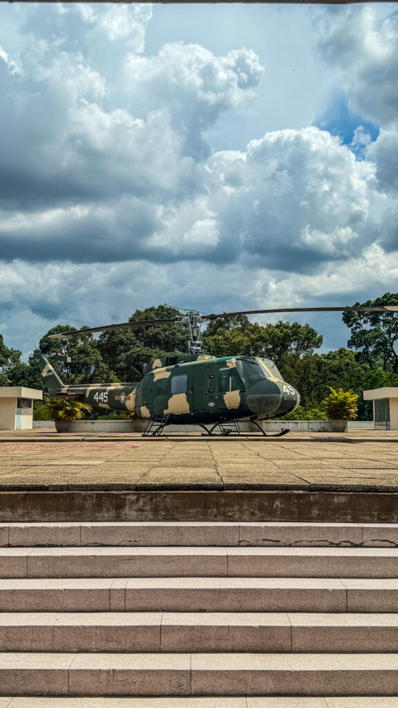 Independence Palace Saigon with UH-1 Huey helicopter and front gate