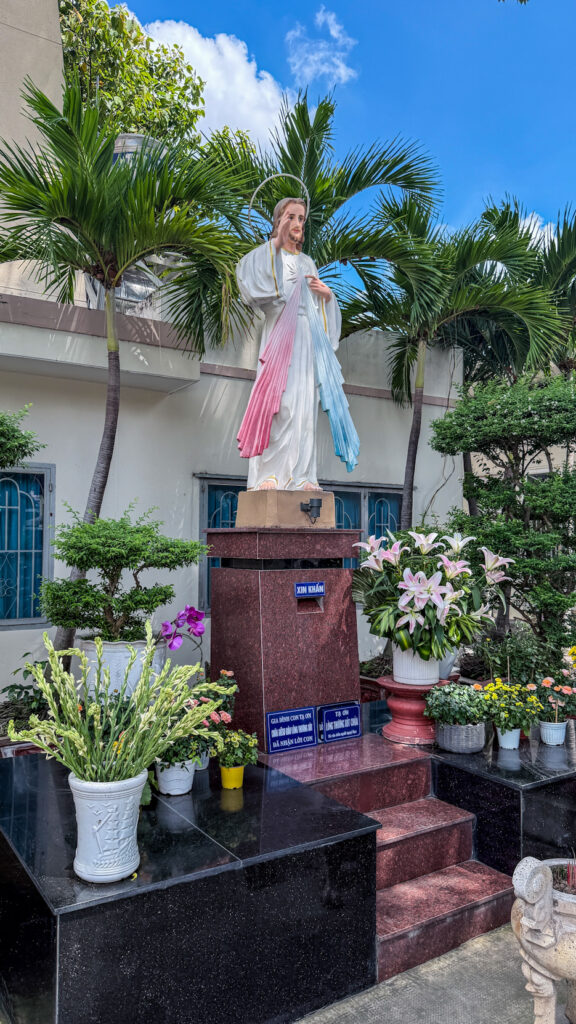 Chi Hoa Church Gothic rose window and stone tower Saigon