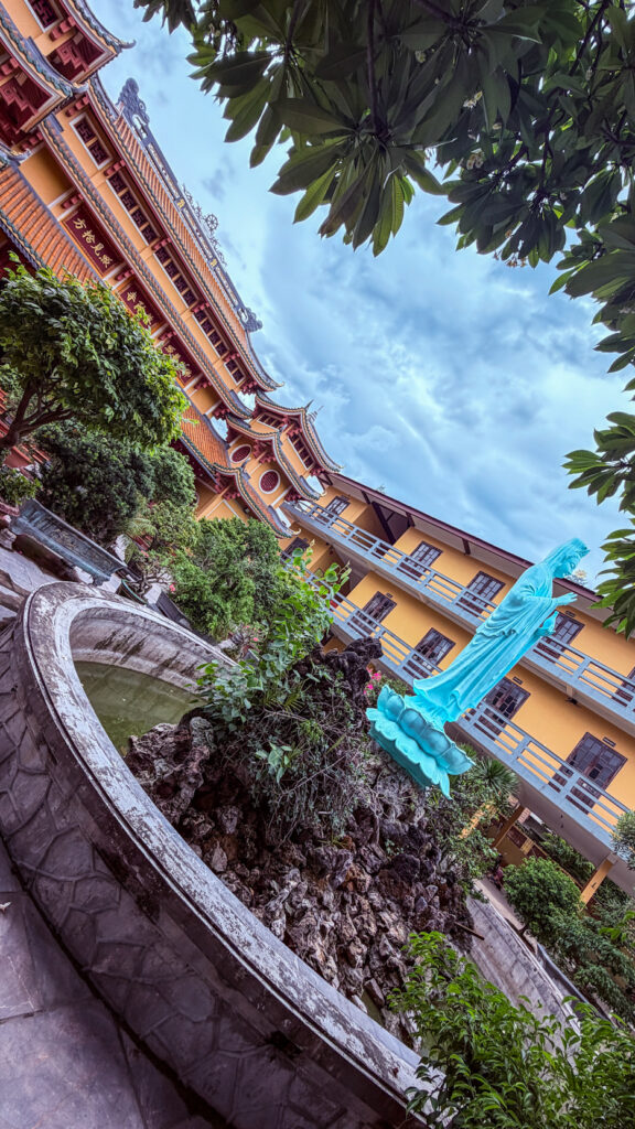Pho Da Temple Quan Am statue on lake and Buddhist university Da Nang