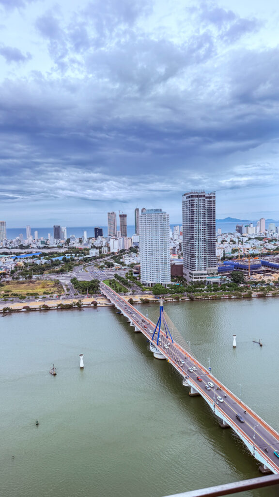 The Sail Hilton Da Nang rooftop with Han River sunset view