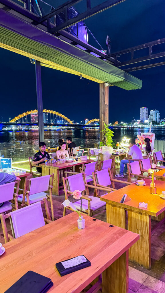 The View restaurant on Happy Yacht with Dragon Bridge fire show at sunset

