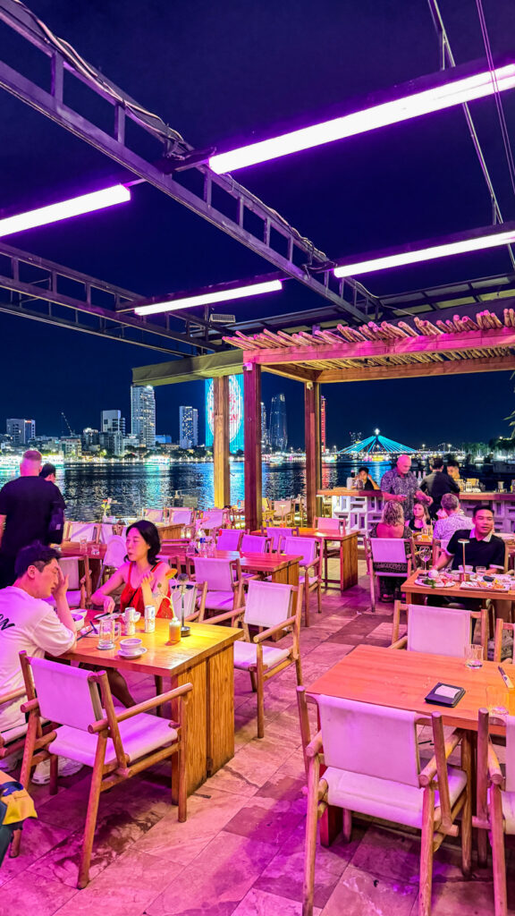 The View restaurant on Happy Yacht with Dragon Bridge fire show at sunset

