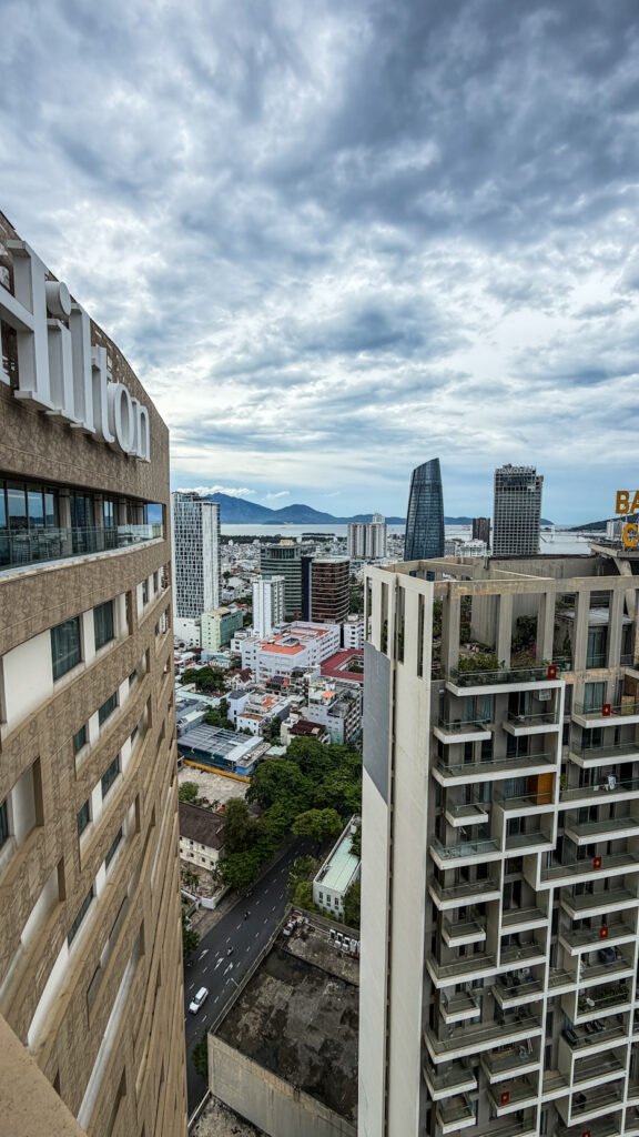 The Sail Hilton Da Nang rooftop with Han River sunset view